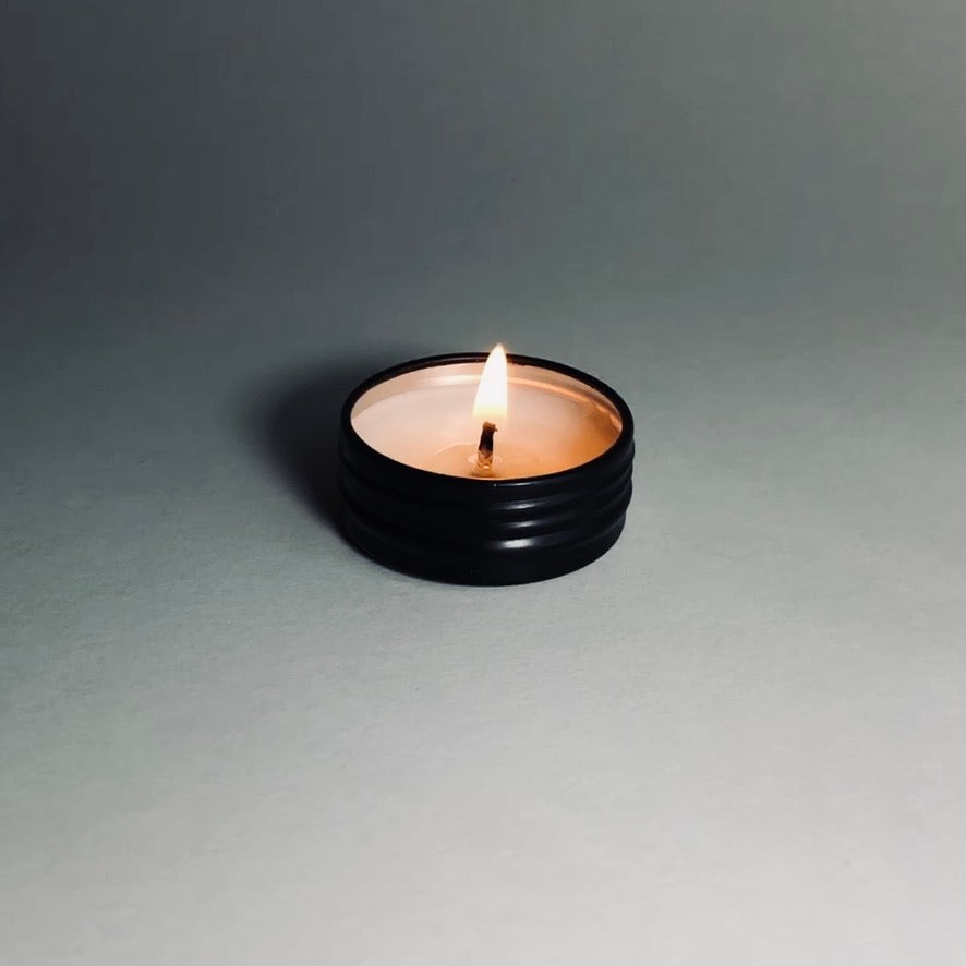 Picture of black sample tin candle. 