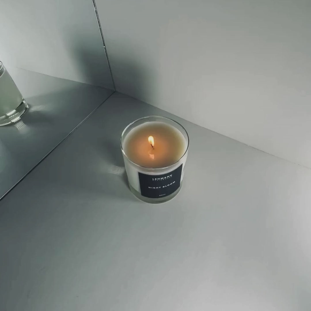 Floral luxury coconut soy wax candle burning.